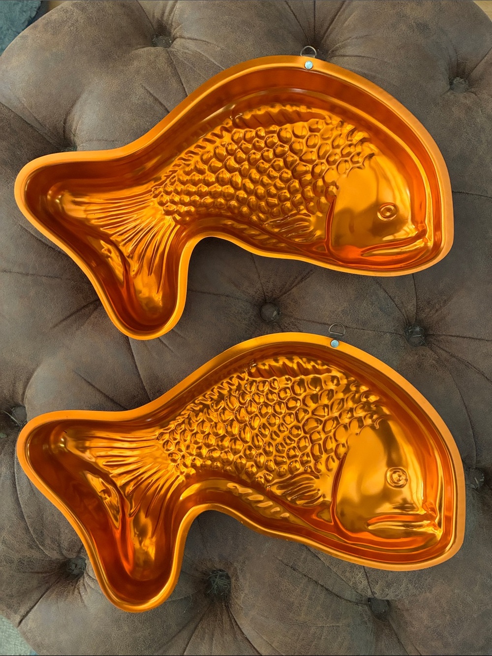 Pair of vintage copper-tone fish-shaped metal jello molds.